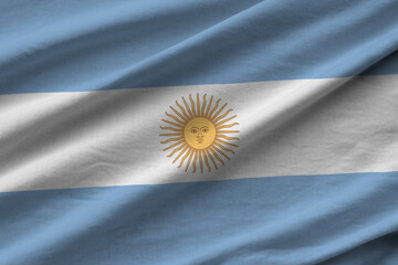Argentina flag with big folds waving close up under the studio light indoors. The official symbols...
