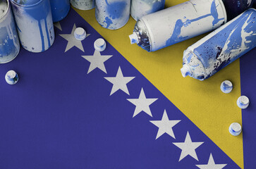 Bosnia and Herzegovina flag and few used aerosol spray cans for graffiti painting. Street art...