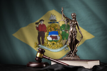 Delaware US state flag with statue of lady justice, constitution and judge hammer on black drapery....