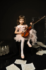 studio portrait of a young violinist with a violin