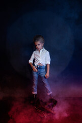 Studio shot of a girl in jeans with gobo masks