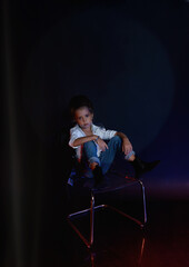 Studio shot of a girl in jeans with gobo masks