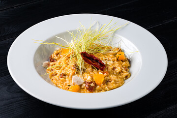 Vegetable pumpkin risotto made of zucchini, carrot, red bell pepper