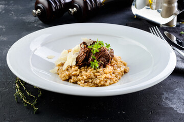 Italian Milanese risotto with beef close up