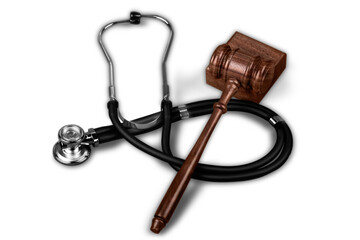 Gavel and stethoscope  on background, symbol photo for bungling and medical error