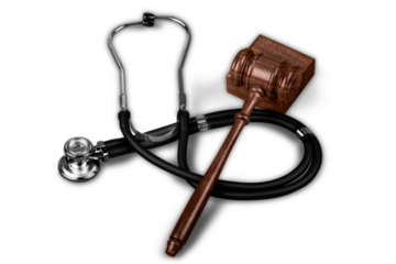 Gavel and stethoscope  on background, symbol photo for bungling and medical error