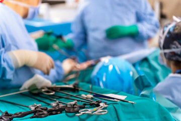 The surgeon's holing the instrument in abdomen of patient. The surgeon's doing laparoscopic surgery in the operating room. Minimally invasive surgery.