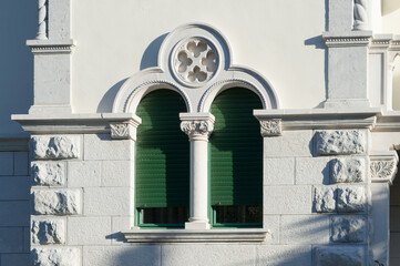 Decorated window of the historic luxury villa in Lovran, Croatia, by the Adriatic coast promenade...