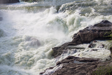 View of gushing water released into kaveri river from the Mettur dam (also known as Stanley Reservoir) through the surplus sluice gates