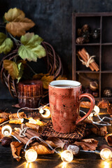 Obraz na płótnie Canvas Still life with tea cup and lights garland