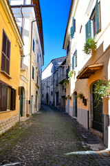 Fototapeta na wymiar A small street between ancient buildings in Boville Ernica, a historic town in the province of Frosinone, Italy.