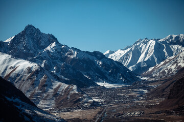 Caucasian mountains covered with snow on a sunny day