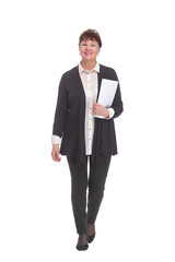 Adult female in black suit holding papers in her hand, isolated on white