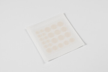 Set of round acne patches on white background. Close-up acne patch facial rejuvenation. Facial...