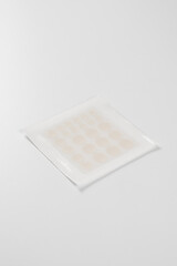 Set of round acne patches on white background. Close-up acne patch facial rejuvenation. Facial cleansing cosmetology.