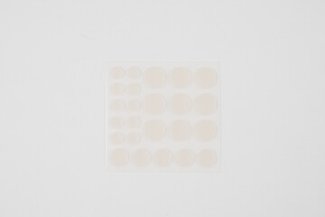Set of round patches for acne on white background. Acne patches for the treatment of pimple and rosacea close-up. Facial rejuvenation cleansing cosmetology.