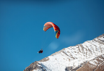 paragliding in winter in the mountains