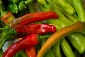Hot chili pepper background. Red and green peppercorns as a background. Healthy food concept.
