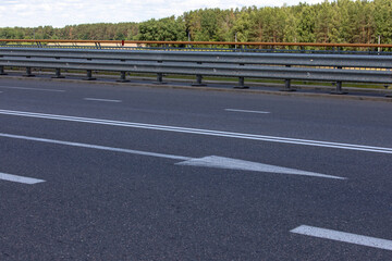 Paved road for cars, freeway in summer.