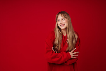 Obraz premium White blonde woman wearing hoodie smiling and looking aside