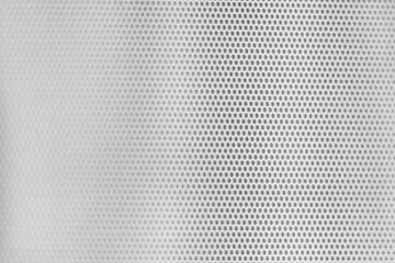 White grill texture with small aligned circular holes
