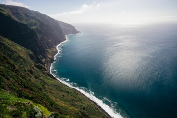 Beautiful shot of the south coast of Madeira with calm waves on a sunny day
