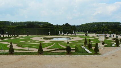 Beautiful shot of the Gardens of Versailles with lawns in Versailles, France