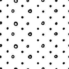 Simple hand drawn geometric pattern. Abstract spots, dashes, polka dots, circles, in black and white. Trendy monochrome brush marks. Ornament in grunge style
