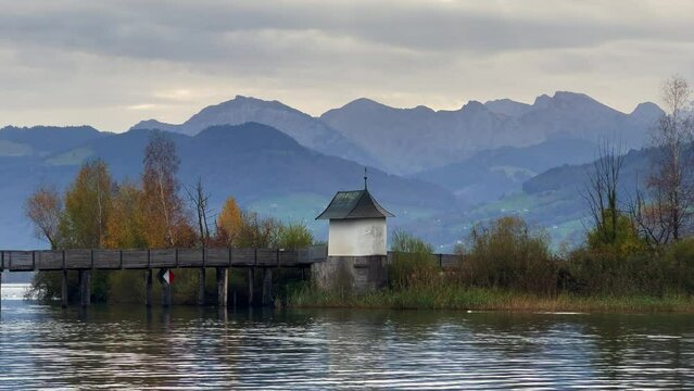 View of the historic Holzsteg (part of the old Way of Saint james) and the Heiligh&uuml;sli chapel (H&uuml;sli, Huesli), Rapperswil, St. Gallen, Switzerland
