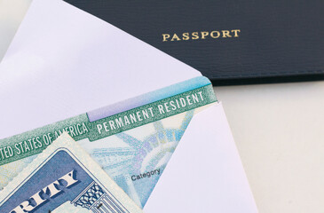 United States passport, social security card and permanent  resident (green) card on white background. Immigration concept