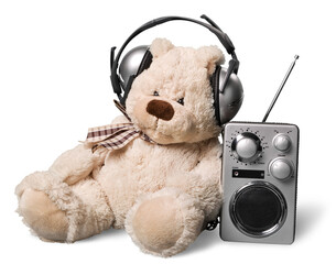 Teddy dear in headphones and radio isolated on white