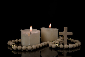 Image With Cross, Bible and Canndles,Rosary with crucifix lying on black