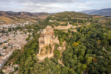 Fototapeta na wymiar The drone aerial view of famous Alhambra de Granada, Andalusia, Spain. The Alhambra is a palace and fortress complex located in Granada.