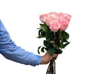Man's hand holding a bunch of flowers pink roses on a white background with space for text. Top view, flat lay