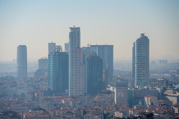 Fototapeta na wymiar Skyscrapers Between City Buildings
