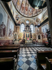 Fototapeta na wymiar Holy Cross, Poland, October 16, 2022: Former Benedictine monastery and now the Missionary Oblates of Mary at the Holy Cross, Lysa Gora. Interior of the chapel of the Holy Cross