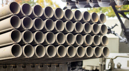 The old Soviet BM-21 Grad multiple launch rocket system on the chassis of a 375D truck. MLRS 9K51 caliber 122 mm close-up, rear fragment. Artillery mount of 40 empty tubular rails.