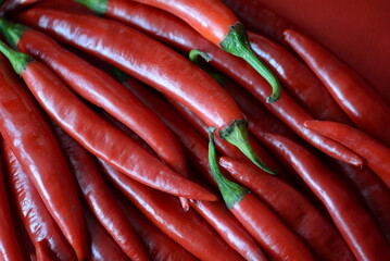 background of red hot peppers close-up, natural red background without processing texture of vegetables, eco cooking