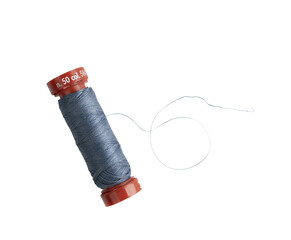 a spool of blue sewing thread