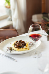 Stylish serving of food in the restaurant. Serving. Waiter