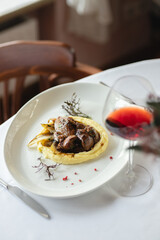 Stylish serving of food in the restaurant. Serving. Waiter