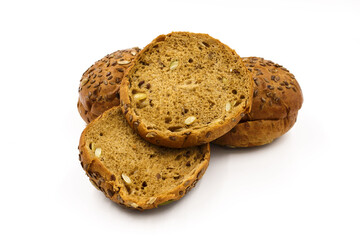 Buns of wheat and rye flour, with seeds on a white background.