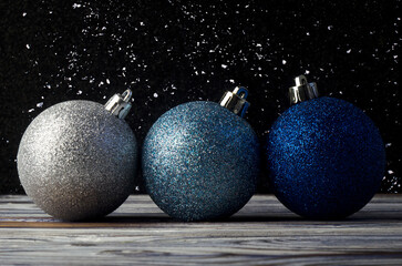 Christmas balls on a wooden background