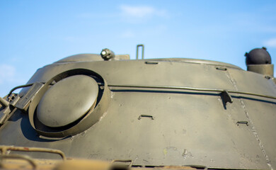 Tower of an armored personnel carrier or tank. Heavy weapons of war, sky background. Army equipment...