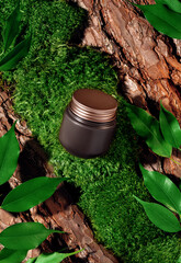 Cosmetic product mockup in brown and gold colors on textured tree bark, moss and leaves podium in...
