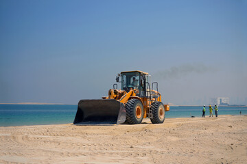 bulldozer works on the seashore