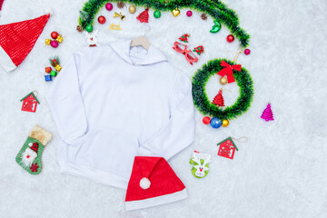 Blank white Hoodie Mockup Image With Christmas Themed Decorations Around it