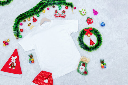 Blank White Shirt Mockup Image Encircled by Christmas Themed Decorations