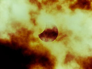eclipse of the sun over Germany through the clouds on 10.25.2022

