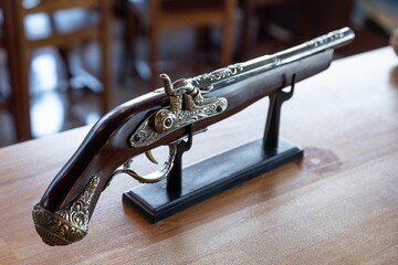 Closeup shot of a wooden vintage pistol